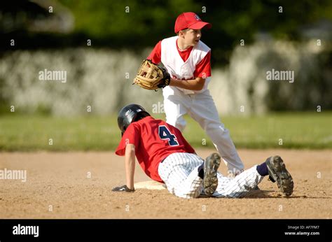 Baseball Player Sliding Into Second Base Stock Photo Alamy