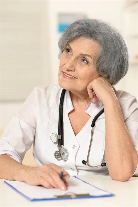 Mature Female Doctor With Money Stock Image Image Of Human Deposit 108927291