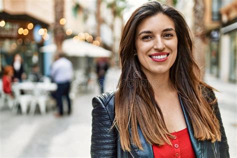Young Hispanic Girl Smiling Happy Standing At The City Stock Image