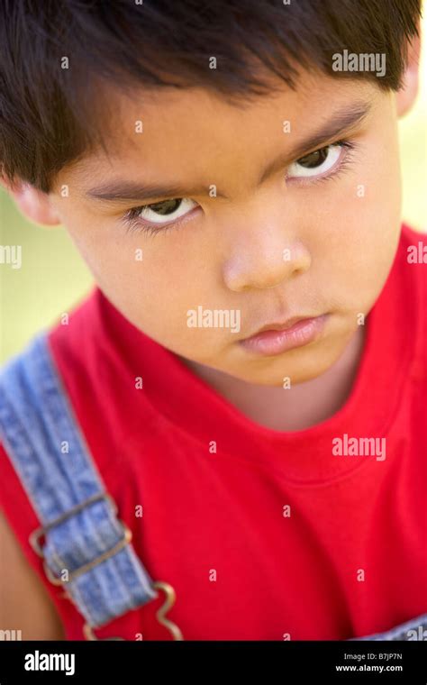 Portrait Of Young Boy Sulking Stock Photo Alamy