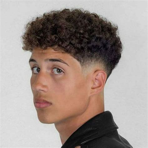 This fade haircut for curly hair is a medium to high bald fade with the. Curly Hair Fade | Taper fade haircut, Male haircuts curly, Fade haircut