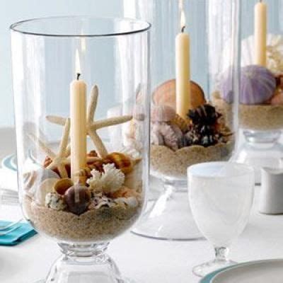 .beach themed china, beach themed table setting, beach themed tablescape, porch dining, shell candlesticks, shell candlesticks pillar candle holders, shell centerpiece, shell napkin rings. Sea Shell and Beach Inspired Centerpieces | Beach wedding ...