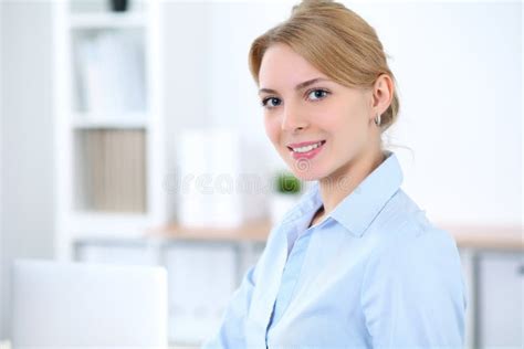Young Blonde Business Woman With Laptop In The Office Business Concept