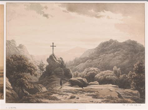 岩の上の十字架のある山の風景