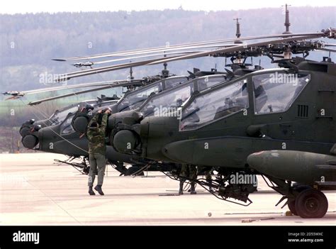 The Us Armys Apache Ah 64 Fighter Helicopters Are Lined Up At