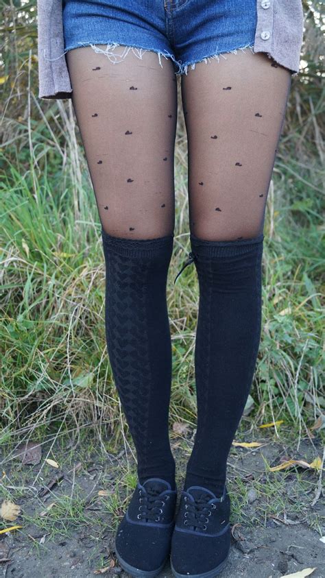 black sheer tights with knee high black wool socks and denim shorts layered socks over tights