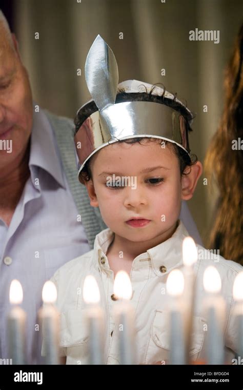 Boy Lighting Hanukkah Candles Stock Photo Alamy