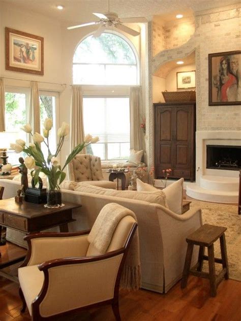 Vases of palm fronds simply picked up from outside complete the tropical decor. seating/with desk behind couch. good idea for an extra ...