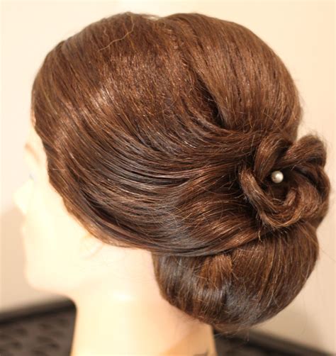 Low Bun With Floral Decoration Long Hair Styles Hair Styles Hair Updos
