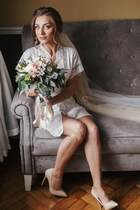 Gorgeous Beautiful Bride In Silk Robe Holding Modern Bouquet And Stock