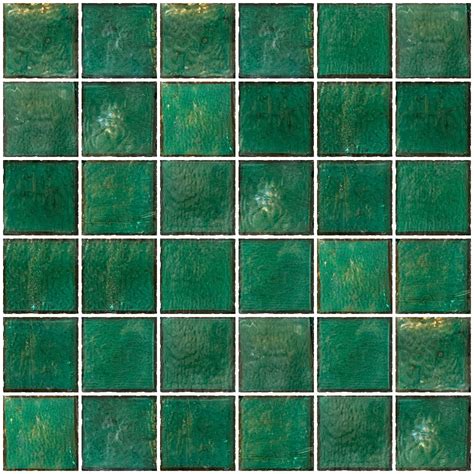 A Green Tiled Wall With Lots Of Small Squares