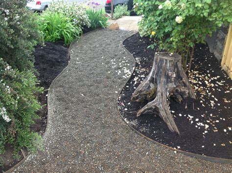 Concrete edger will add a decorative touch to your landscape. Garden paths with curved steel edging | Garden paths, Garden inspiration, Garden design