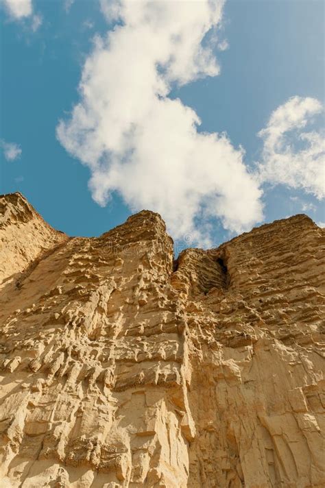 The Imposing And Eroded Sandstone Cliffs Exposing Millions Of Years Of