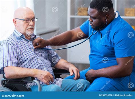 Professional Doctor Helps An Elderly Man With Chronic Diseases