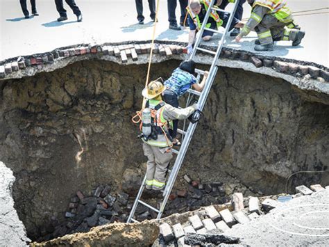 Driver Rescued After Car Falls Into Ohio Sinkhole CBS News