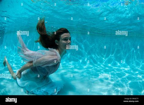 13 Year Old Girl Underwater In Swimming Pool Kauai Hawaii Stock Photo
