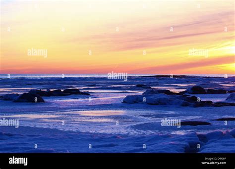 Pink Sunrise Over A Frozen Lake Huron Stock Photo Alamy