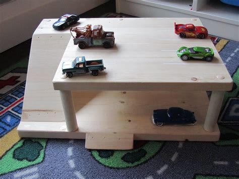 If you have a child in your life that plays with hot wheel cars, check out this diy hot wheels parking garage. DIY Parking Garage for kids | Diy kids toys, Toy garage