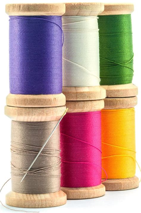 Isolated Wooden Spools Of Thread With A Needle Stock Image Image Of