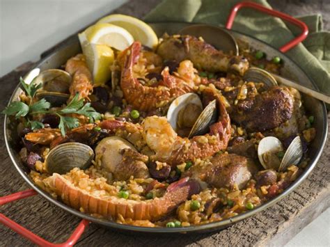 This seafood casserole is full of shrimp and scallops so it's a seafood lover's delight. Paella with Seafood, Chicken, and Chorizo Recipe | Tyler ...