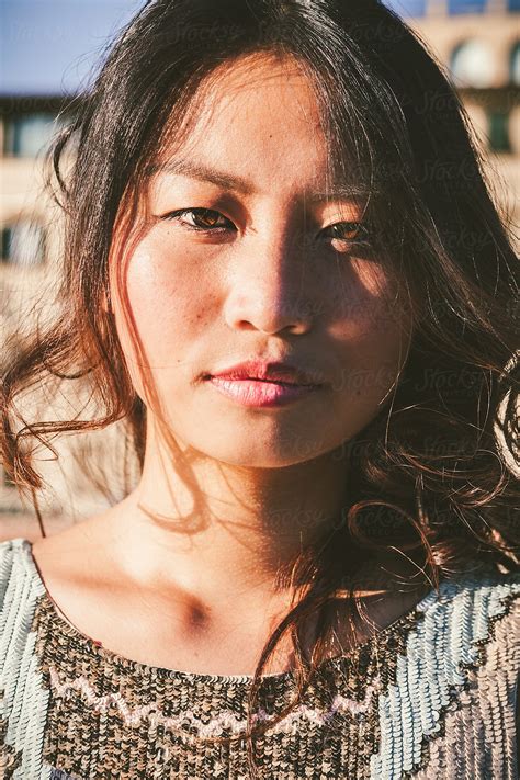 Young Asian Female Direct Sunlight Portrait By Stocksy Contributor Giorgio Magini Stocksy