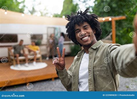 Black Guy Taking Selfie Near Motorhome Gesturing Peace Resting With His Multiracial Friends
