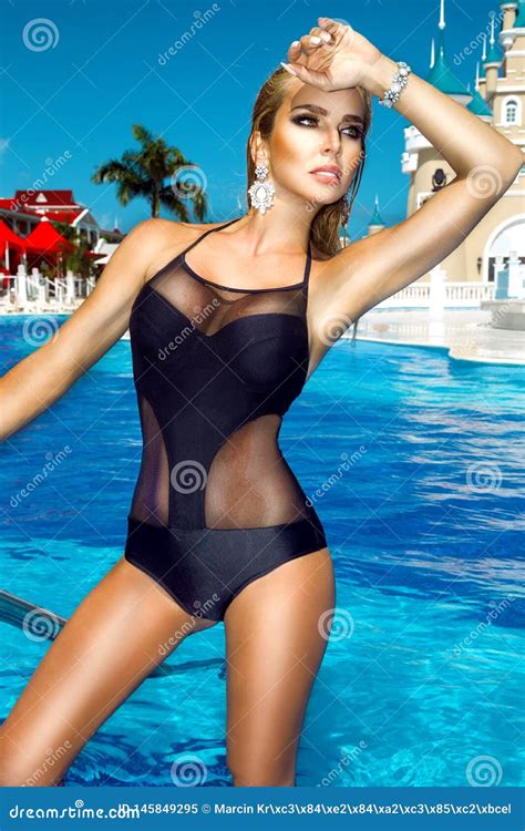 Elegant Woman In The Elegant Bikini On The Sun Tanned Slim And Shapely