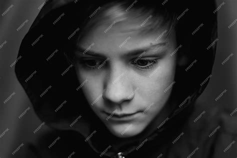 Premium Photo Black And White Portrait Of Teenage Boy On Dark