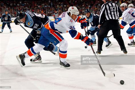 Steve Staios Of The New York Islanders Tangles With Tomas Kopecky Of