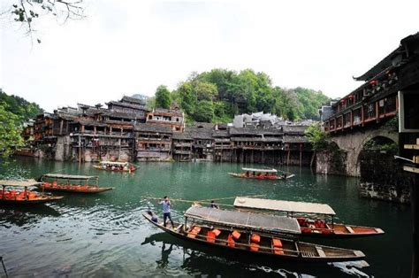 Tourists Travel By Boats At The Fenghuang Ancient Town In Xiangxi Tujia Miao Autonomous