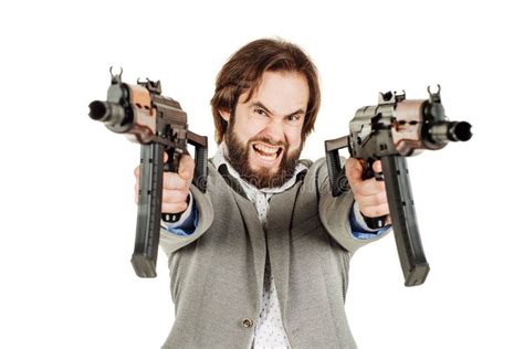 Man Holding A Machine Gun Isolated On White Background Stock Photo