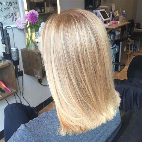 In combination with darker blonde hints at the roots, the mix will definitely turn some heads. butter blonde - balayage - hair painting - sandy blonde ...