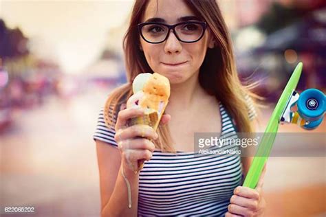 girl licking ice cream photos and premium high res pictures getty images