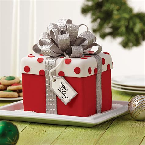 Cleverly arranged and stacked squares of sheet cake are frosted and christmas cakes and cupcakes recipes & ideas. Christmas Gift Box Fondant Cake with Bow | Wilton