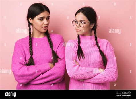 Image Of Two Angry Teenage Girls With Braids In Casual Clothes Standing