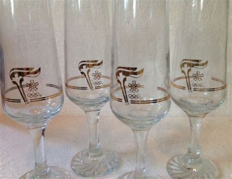 1988 Calgary Canada Olympics Set 4 Champagne Stemmed Flute Gold Trimmed Glasses Ebay