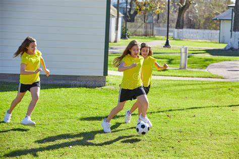 Friend Girls Teens Playing Football Soccer In A Park Stock Image