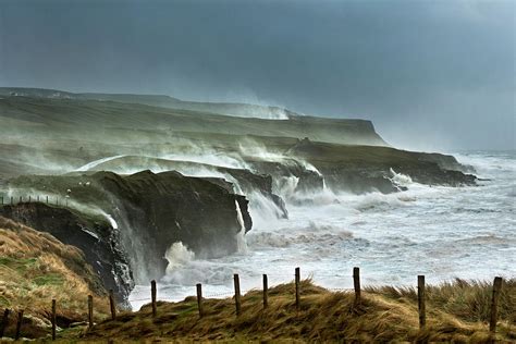 Waves Crashing On Rocky Cliffs Photograph By George Karbus Photography