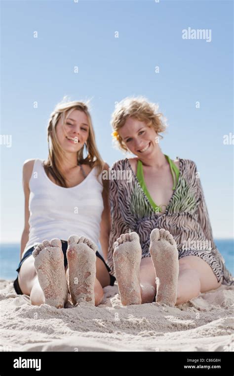 Women With Sandy Feet On Beach Stock Photo Alamy