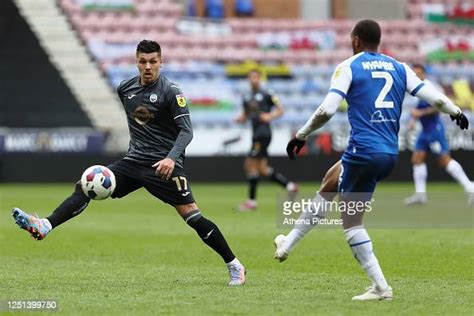 Joel Piroe Of Swansea City And Ryan Nyambe Of Wigan Athletic In News Photo Getty Images