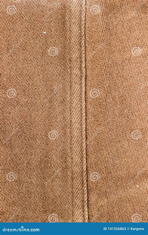 Texture Of A Brown Denim Fabric With Decorative Topstitching Two