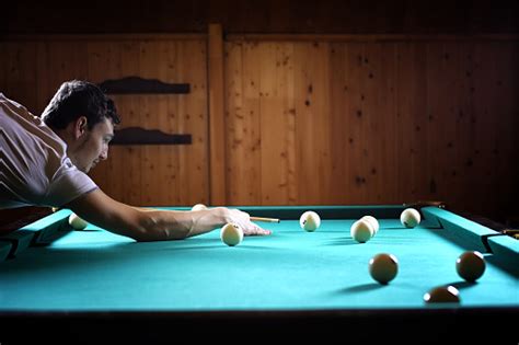 A Man With A Beard Plays A Big Billiard Party In A 12foot Pool Billiards In The Club Game For