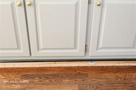 Find a joint or an end for the toe kick to start prying. How-To Get A Custom Cabinet Look Using Trim - Sincerely, Marie Designs