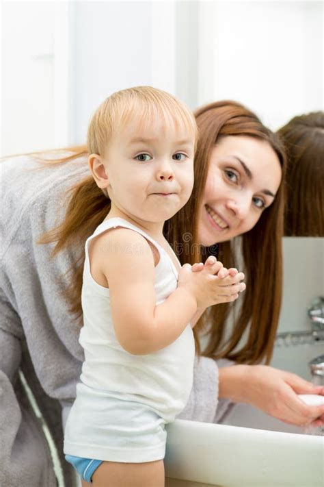 Happy Mother And Kid Washing Hands With Soap Stock Photo Image Of