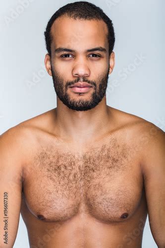 Handsome And Confidant Portrait Of Handsome Shirtless Young Black Man