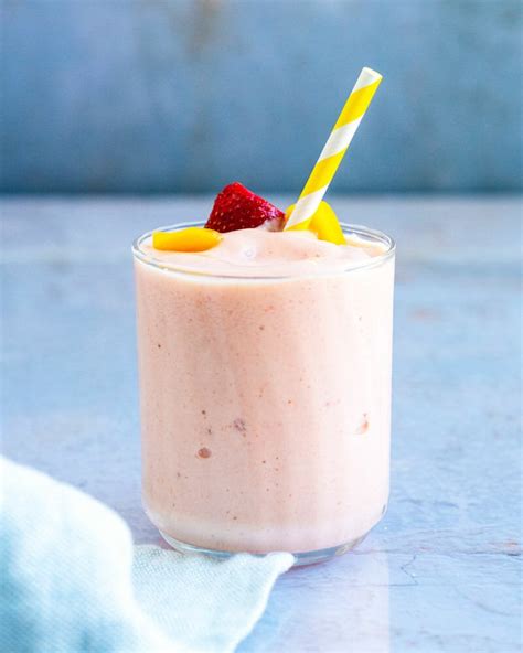 This easy mango smoothie recipe is fresh, super creamy, fruity, and delicious! *Best* Strawberry Mango Smoothie - A Couple Cooks