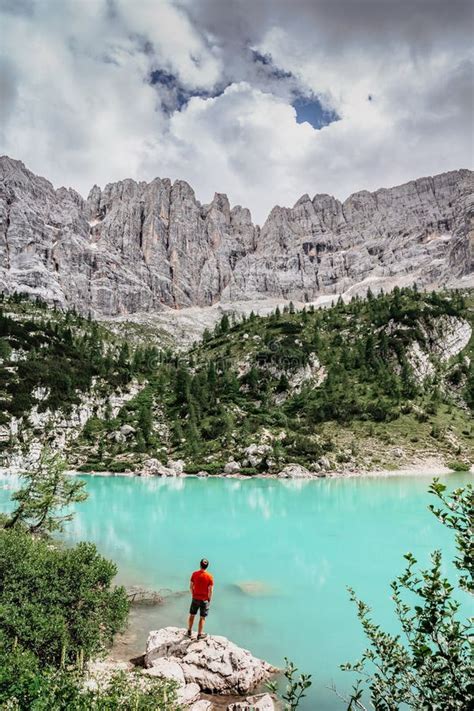 Male Backpacker Enjoying Turquoise Lago Di Sorapiss Mountain Lake