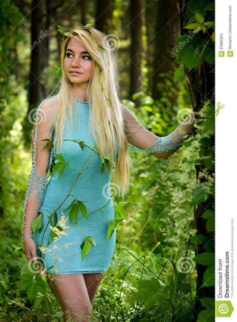 Pretty Young Blonde Girl With Long Hair In Turquoise Dress