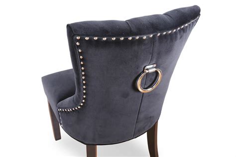 The chair features a molded back with timeless button tufting for added detail. Ariana Classic Lux Velvet Dining Chair Brisbane Furniture