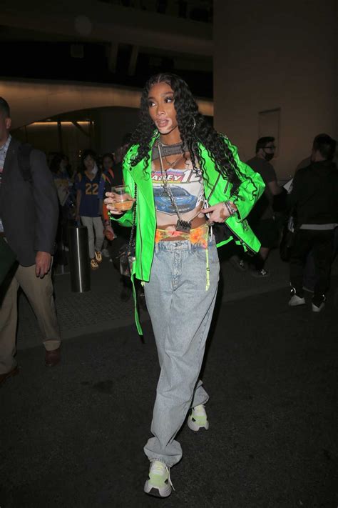 winnie harlow in a neon green jacket leaves after the rams win super bowl lvi at sofi stadium in